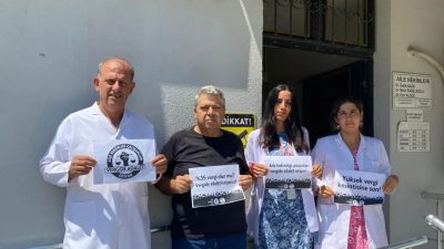 Antakya Karali Aile Sağlık Merkezi çalışanları, vergi adaleti talebiyle düzenlenen