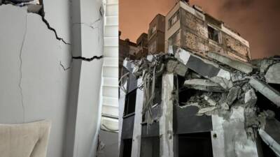 Hatay’ın İskenderun ilçesinde, depremde ağır hasar gören bir binanın yıkımı