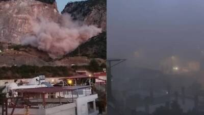 İskenderun'da bir taş ocağında yapılan patlatma sonrası Modernevler Mahallesi toz