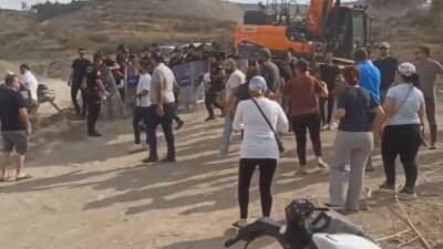 Hatay’ın Samandağ ilçesinde Kurtderesi Mahallesi sakinleri, tapulu mandalina arazilerinin TOKİ